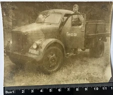 beautiful young guys Cute soldiers in uniform near the car, old photo