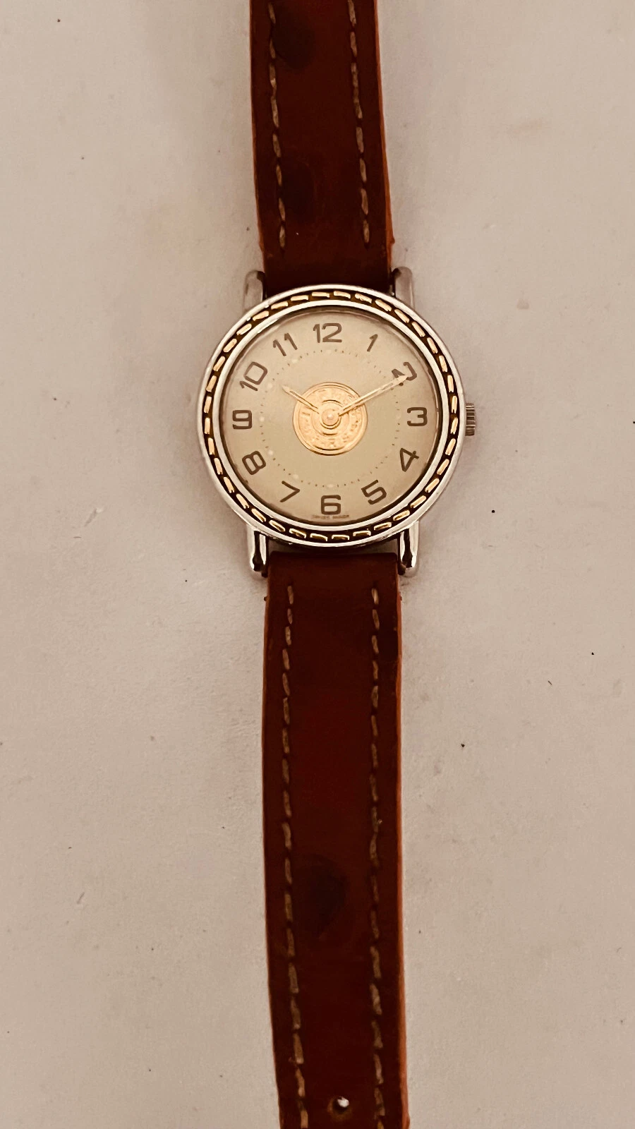 Montre Hermès Sellier Or et acier