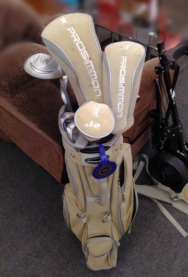 Set of ten PROSIMMON golf clubs including bag, cart, and accessories