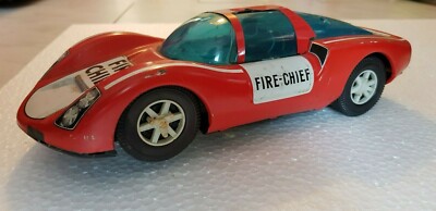 ANCIENNE VOITURE JOUET EN TOLE JOUSTRA?DINKY? AVEC PERSONNAGE