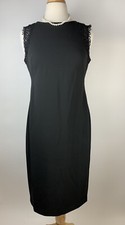 Gorgeous Calvin Klein little black dress with lace accent sleeves.