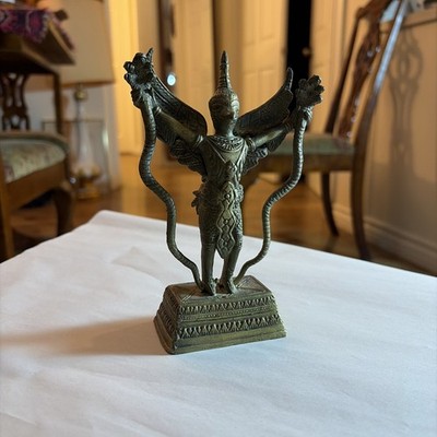 Antique bronze figurine of Garuda, the mythical bird-like mount of Vishnu.