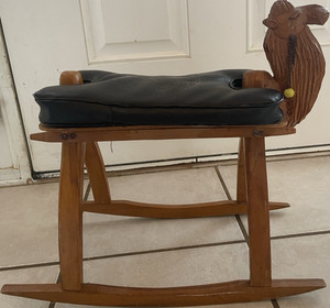 Hand carved camel saddle stool