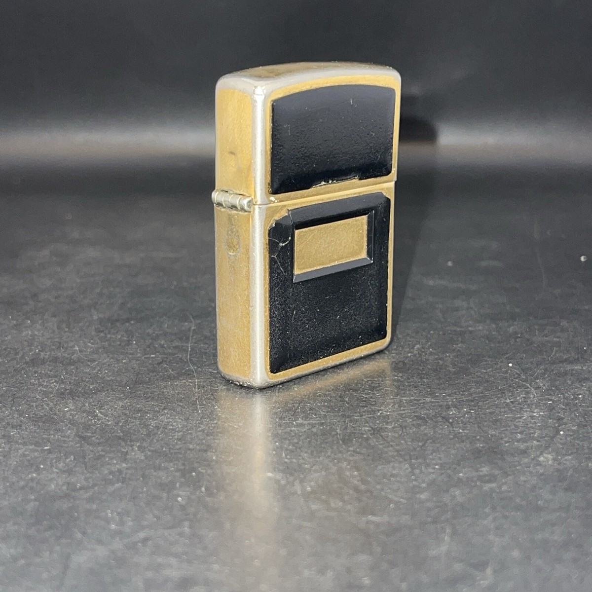 VTG 1994 D X Zippo Gold Brass Black Plastic - UNENGRAVED HAS WEAR