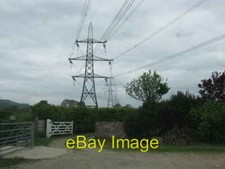 Photo 6x4 Pylon towers over the gateway Atrim  c2010