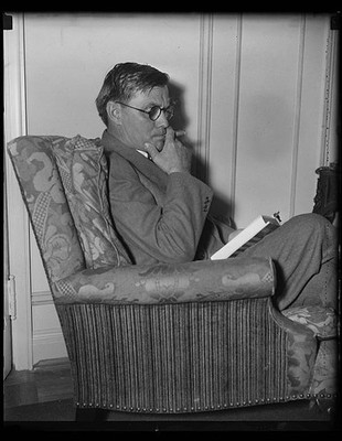 Photo:1935 Man Reading Book in Armchair Pipe Glasses Portrait
