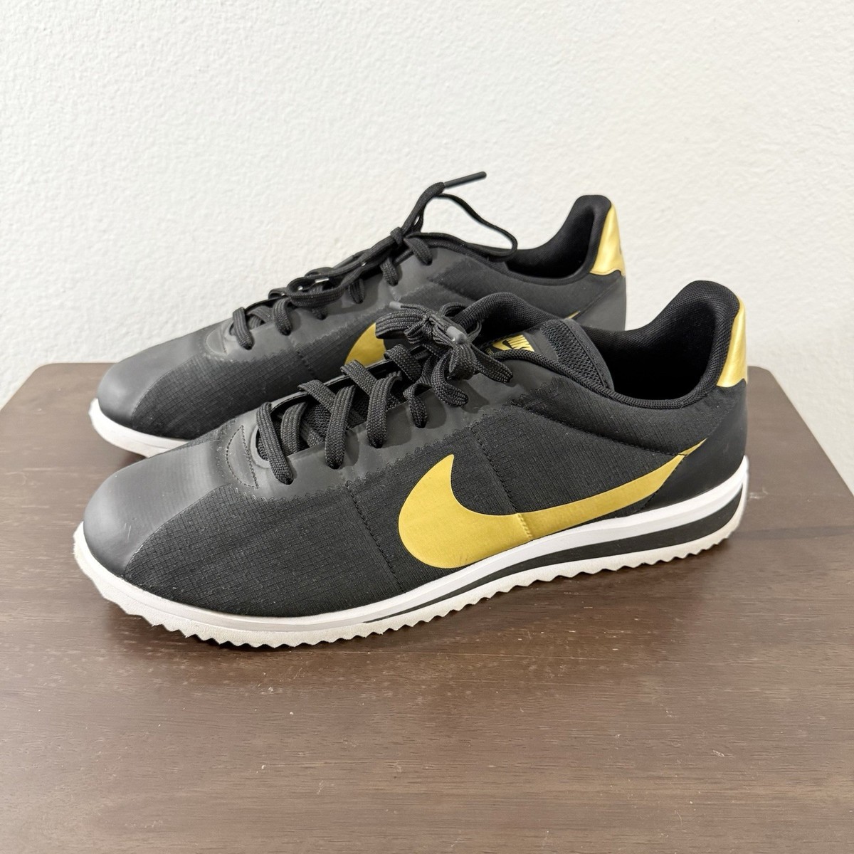 nike cortez ultra black gold