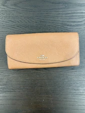 Tan Coach long envelope wallet