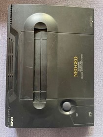 Neo Geo console, 2 controllers, 5 ROM cartridges, and 1 memory card.Tested 