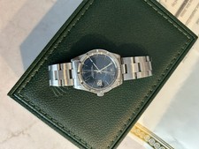 Rolex Date 15010 34mm Blue Dial Stainless Steel Engine-Turned Bezel Box Paper