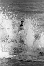 1960s Negative-sexy pinup girl Gail Poehls on rock in surf-cheesecake t458140