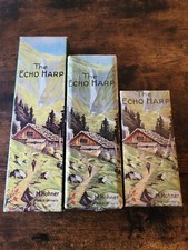 Two Hohner Echo Harp 56/96 M2 C/G Harmonicas And A 54/62 M2 C/G Harmonica.