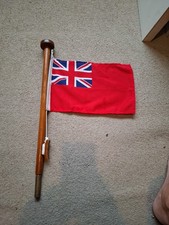British Red Ensign Flag Mounted On A Wooden Staff With  Traditional Toggled Rope