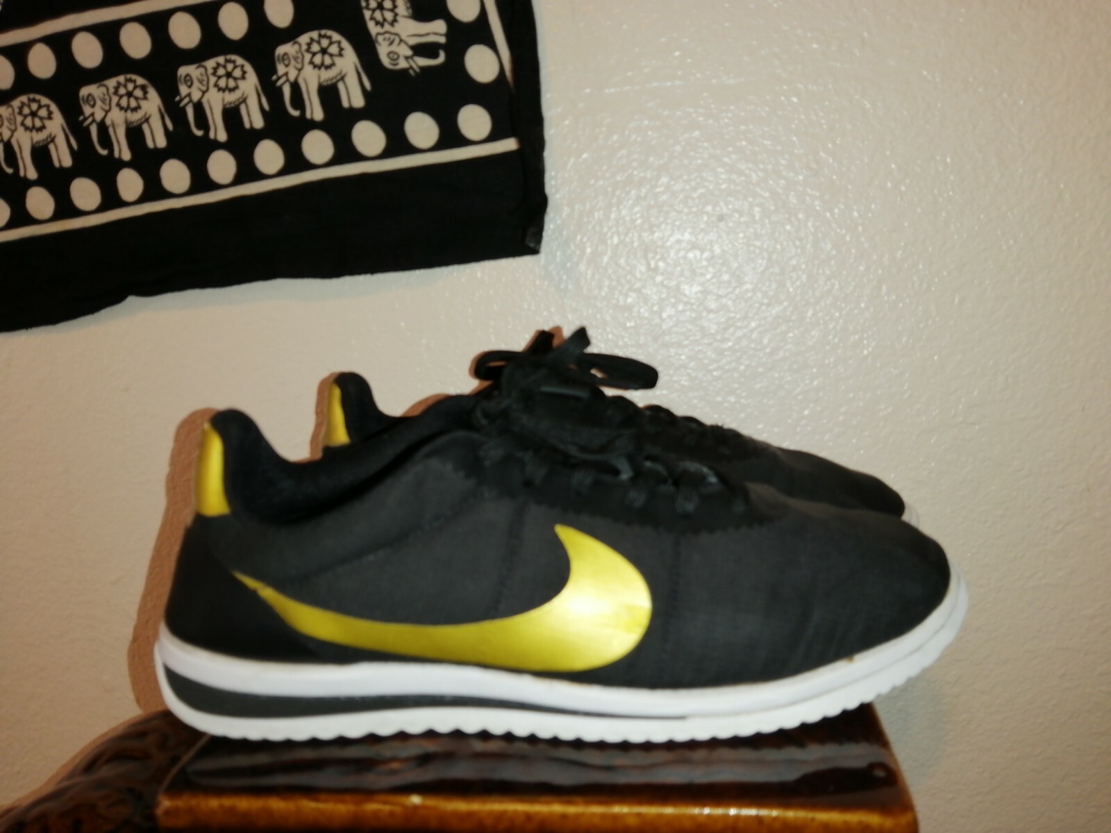 nike cortez ultra black gold
