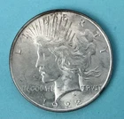 1922 X/FINE  ++.  SILVER PEACE DOLLAR with some neat TONING