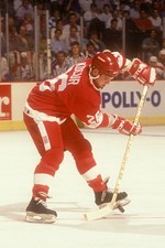 Joey Kocur Detroit Red Wings receives a pass during a hockey game - Old Photo