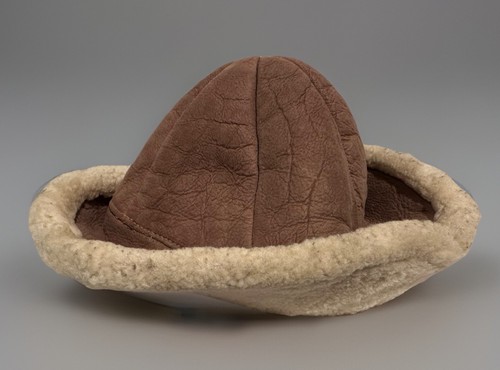 Brown suede vintage ranchero bucket hat with cream shearling lining and tan fabric brim, Made In USA.