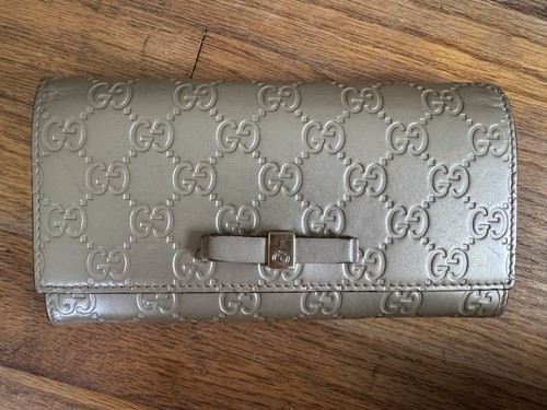 Leather continental wallet, Gucci Guccissima Signature Bow, Gold