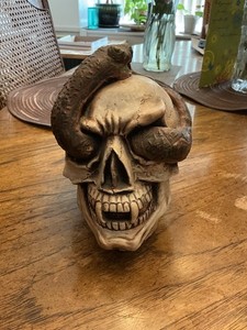 pottery skull with snake crawling through eyes,  Jonbo 76