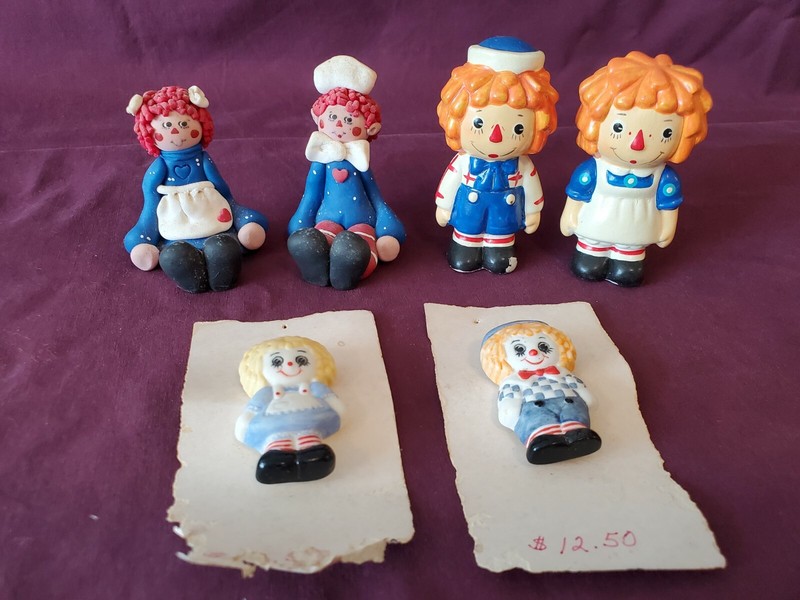 RAGGEDY ANN & ANDY HAND PAINTED PORCELAIN PINS AND FIGURINES.