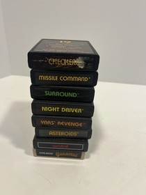 Lot of 8 Vintage Atari 2600 Games w/Manuals Tested Yars Surround Asteroids Comba