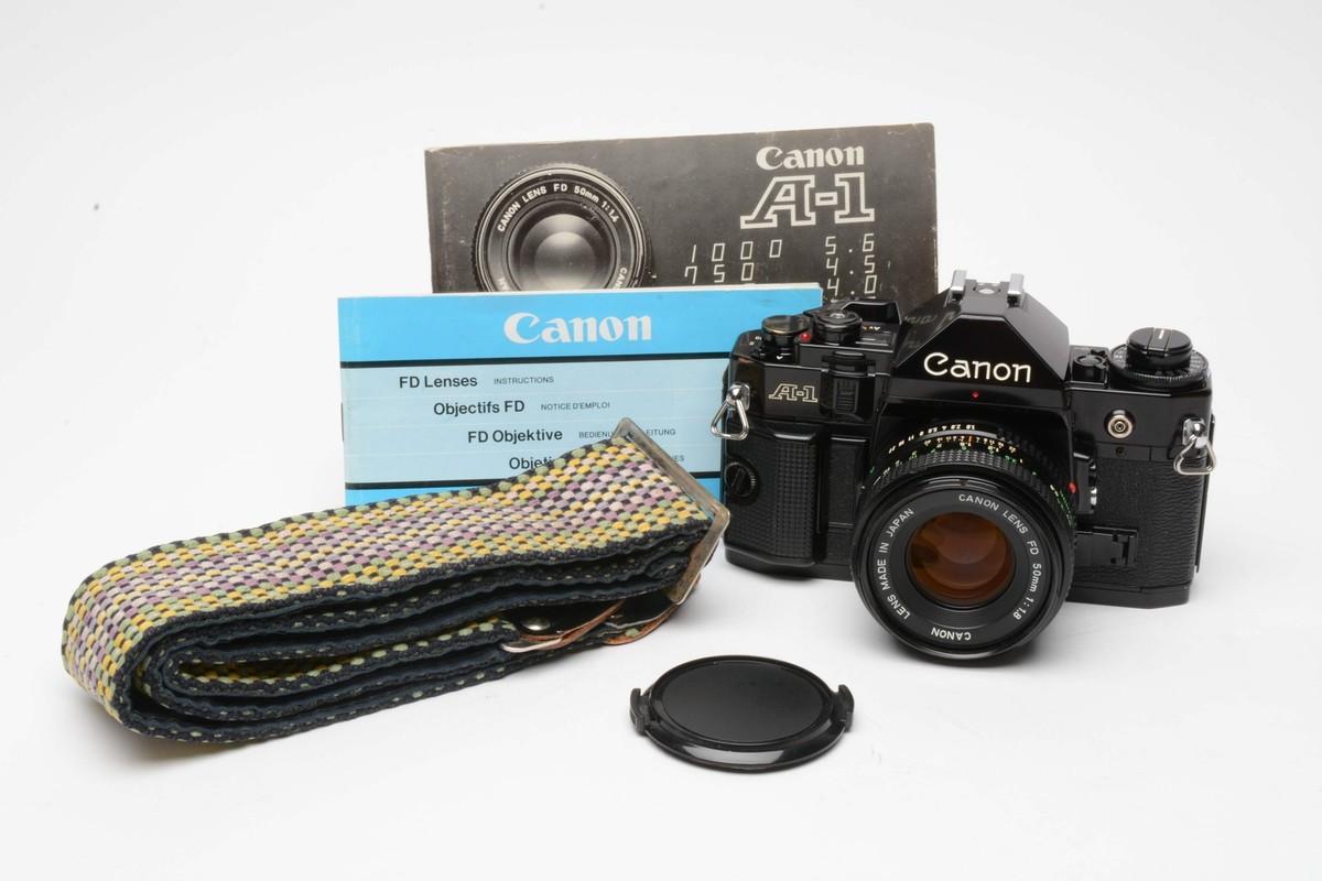 Canon A-1 35mm SLR Body w/50mm f1.8 Canon FD Lens + Cap, Strap