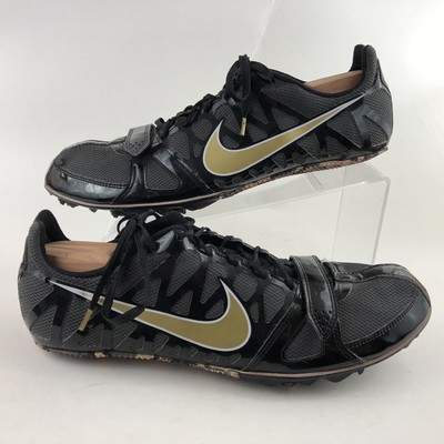 black and gold track shoes
