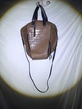 Vince Camuto bag with a suede body and a crocodile-embossed leather panel.