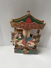 Vintage wooden musical carousel. Small World. Read.