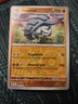 DONPHAN 049/091 PALDEAN FATES POKEMON (REVERSE HOLO, NM)