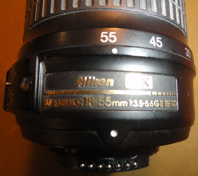 NIKON DX SWM ED ASPHERICAL 0.28M/0.92FT 52 US 6766543 18-55 MM 1