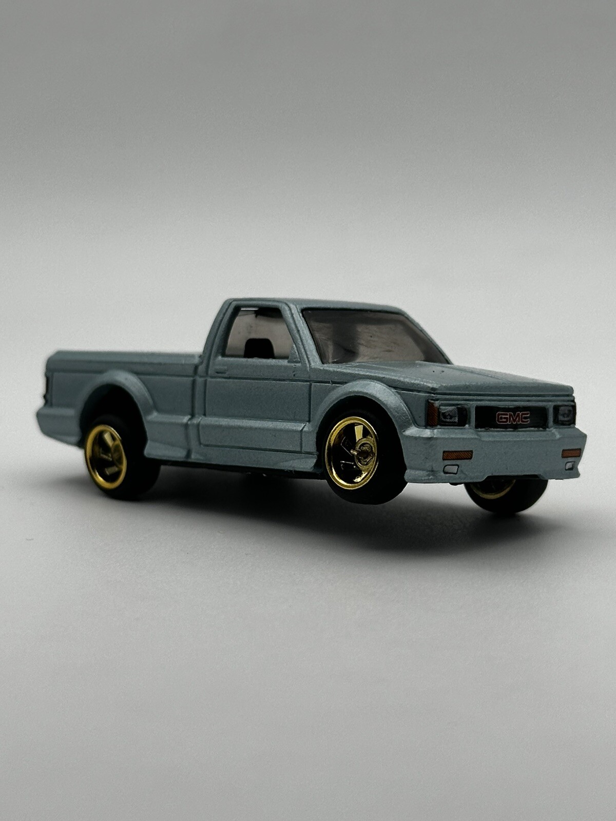 Hotwheels 1991 GMC Syclone Custom Lowrider (adjustable) Comes With Plastic Case