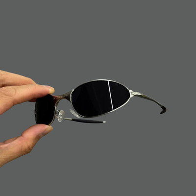Oakley Square Wire 1.0 Sunglasses in a silver frame with black cat-eye lenses