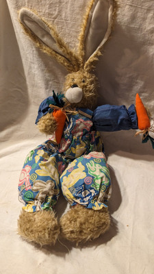 Easter Bunny Holding Two Carrots