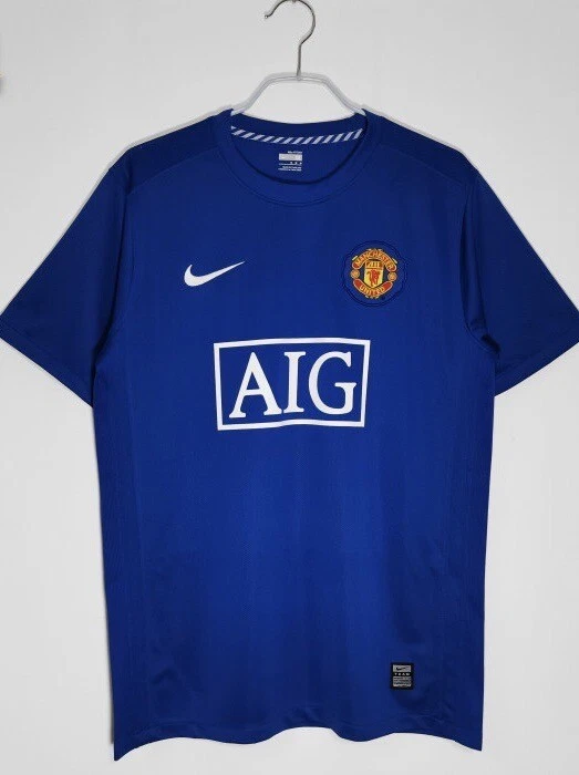 Man utd hotsell blue retro shirt