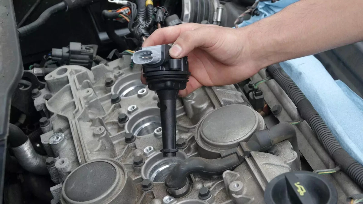 A vehicle owner installs a new ignition coil in an inline four-cylinder engine.