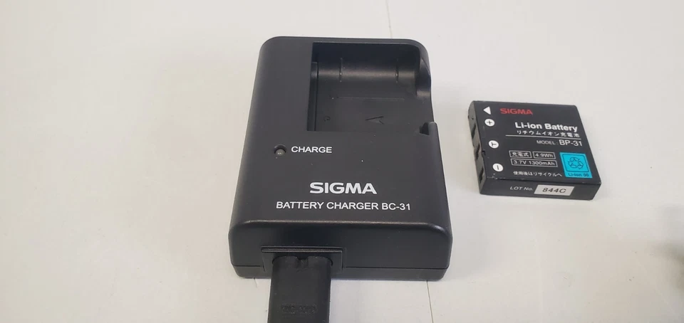 Batería y cargador Sigma BC-31 para cámaras digitales DP BC31 funciona raro Foto 4 de 4
