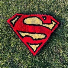 Superman logo rug in red and yellow