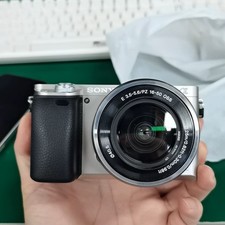 Sony Alpha A6000 Mirrorless Digital Camera Silver w/16-50mm Lens English