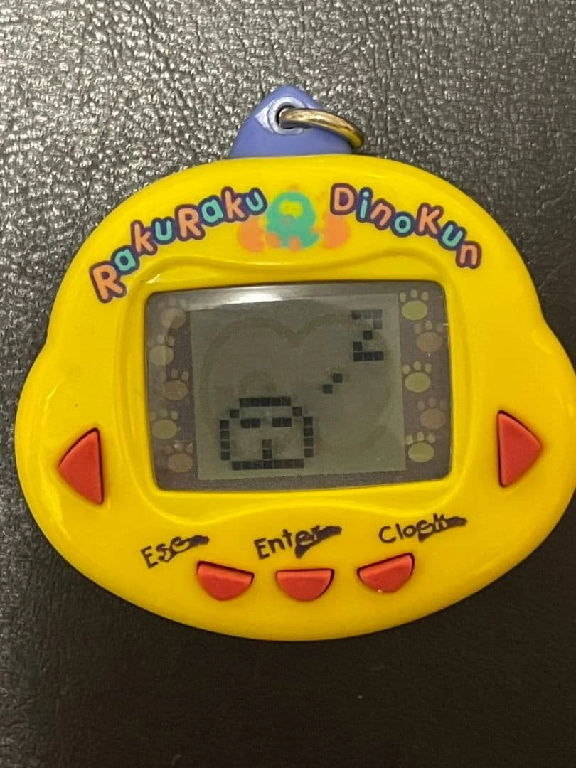 Tamagotchi dinkie dino jaune pour collectionneur
