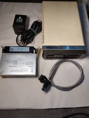 Vtg Atari 1050 Disk Drive w/ Power Supply, Cable and 22 Misc Disks