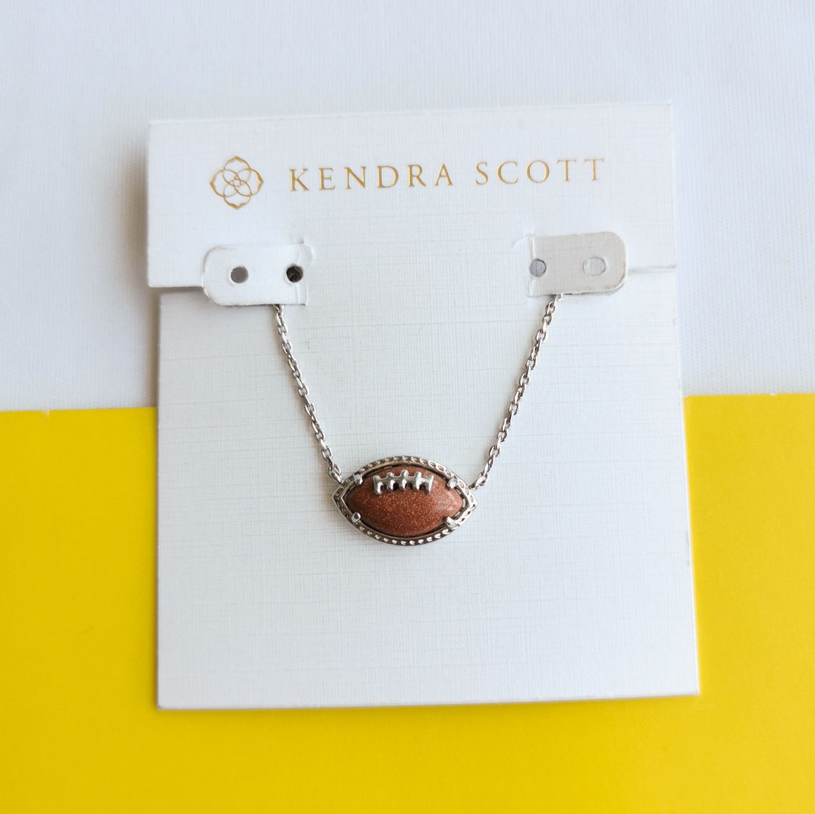 Kendra Scott Silver Orange Goldstone Football Pendant Necklace