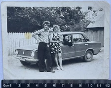 beautiful young guys /girls near the car, an interesting couple, USSR Old Photo