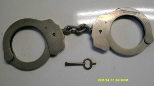 Peerless handcuffs with key vintage