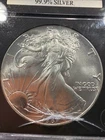 Better Date 1987  Silver Eagle 1 Troy Oz .999 Fine Silver Cracked Case 040227