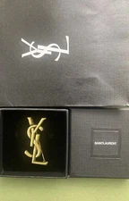 YSL - YVES SAINT LAURENT - LARGE ANTIQUE GOLD TONE LOGO BROOCH PIN