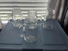 Four Dolly Parton mason jar glasses,