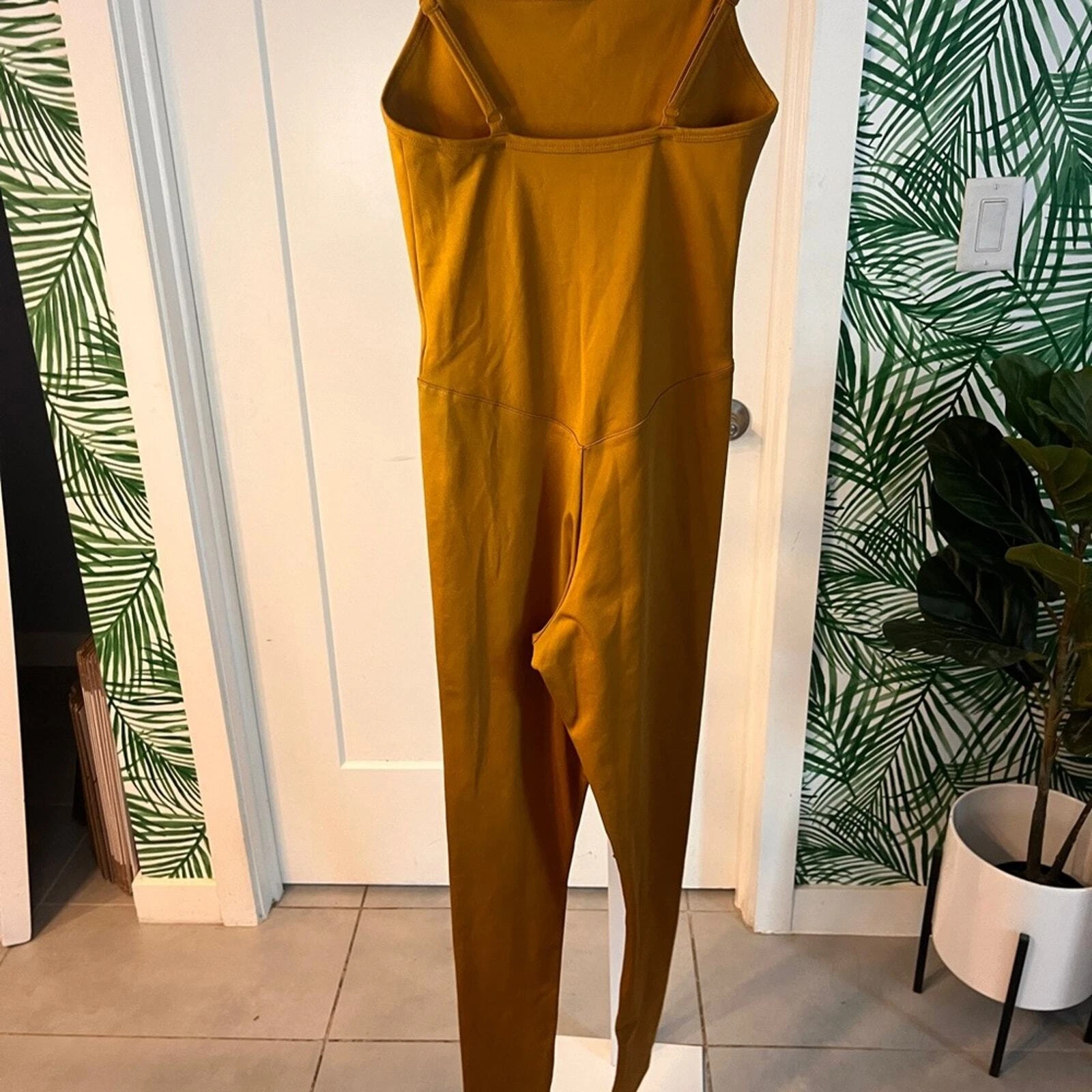 girlfriend-collective mustard one piece unitard 