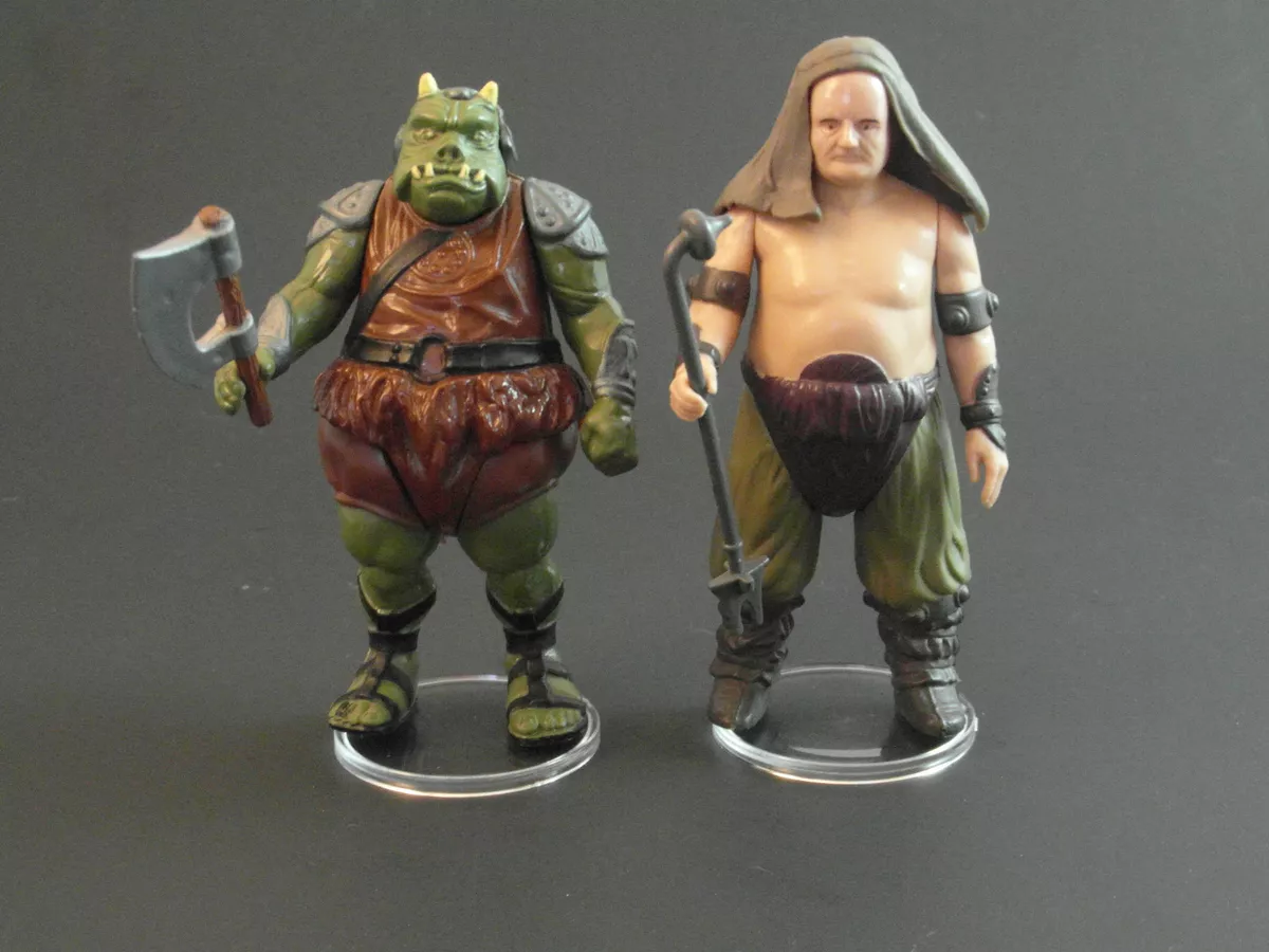 Vintage star wars action figure stands top