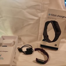 Fitbit Charge 4 Tracker Purple Cracked and strap broken  With Charger Cord